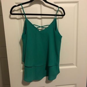 Bouquet tank top with cross cross design on back.